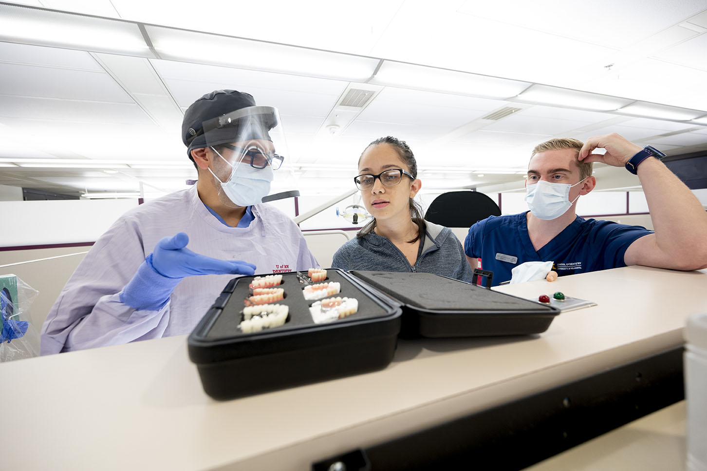 Graduate Prosthodontics examine dental devices